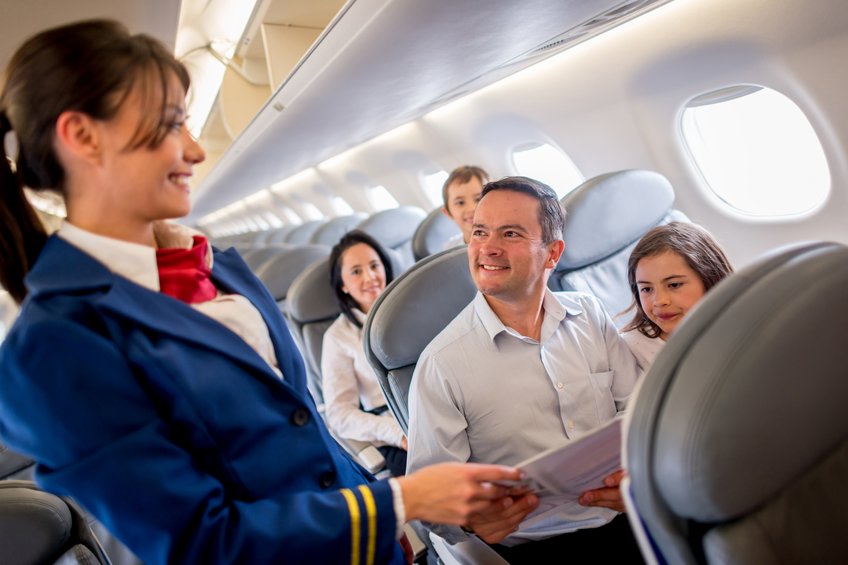 Flight Attendant Catering the Passenger's Needs